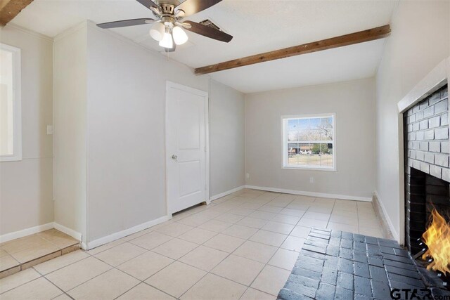unfurnished living room featuring a brick fireplace, light tile patterned flooring, baseboards, and beamed ceiling