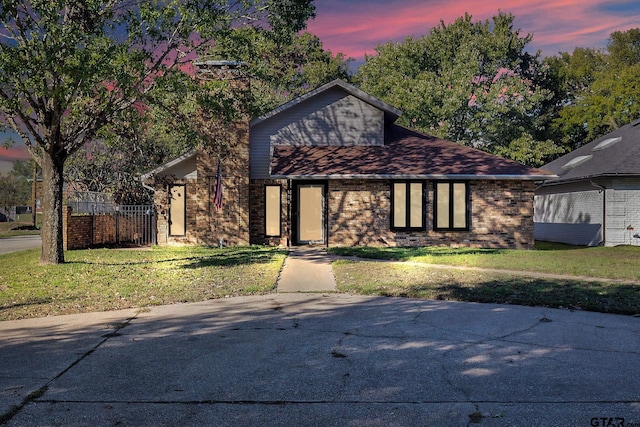 view of front of home with a lawn