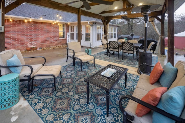 view of patio / terrace featuring ceiling fan, an outdoor living space, and outdoor dining space