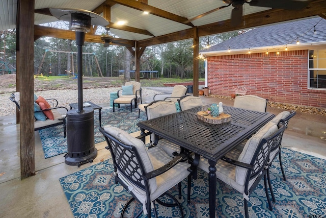 view of patio / terrace with a ceiling fan and outdoor dining area