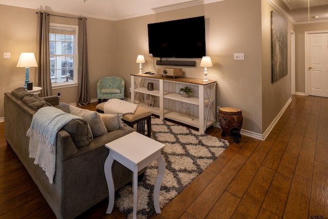 living area with dark wood-style floors, ornamental molding, attic access, and baseboards