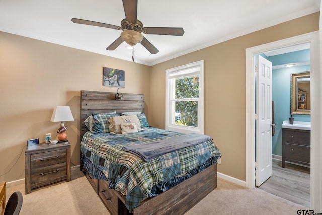 carpeted bedroom with ceiling fan, connected bathroom, and ornamental molding