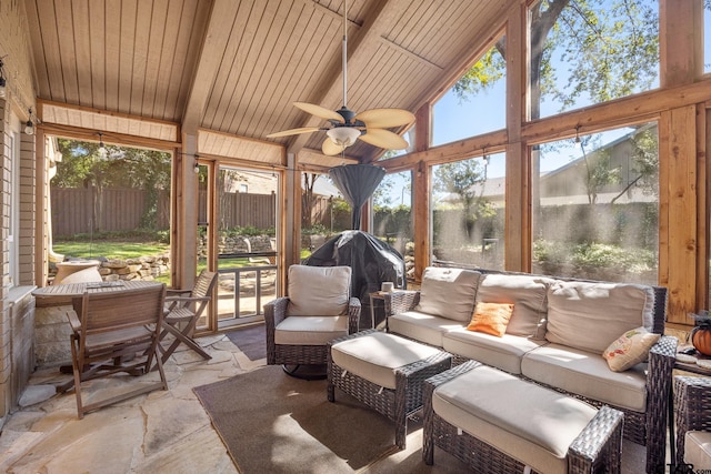 sunroom featuring ceiling fan, wood ceiling, and vaulted ceiling