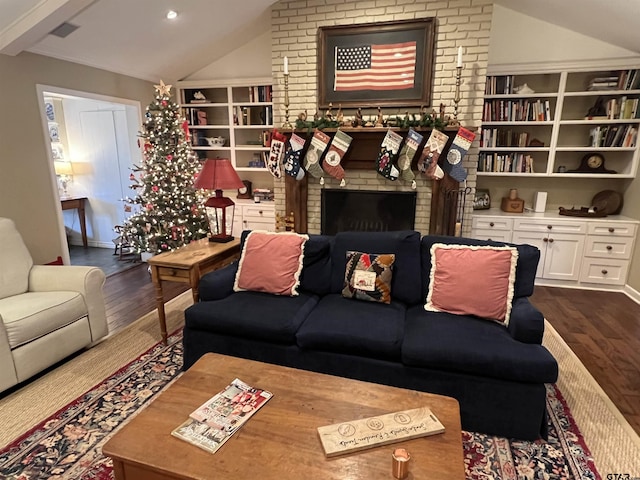 living room featuring a fireplace, dark hardwood / wood-style floors, and lofted ceiling