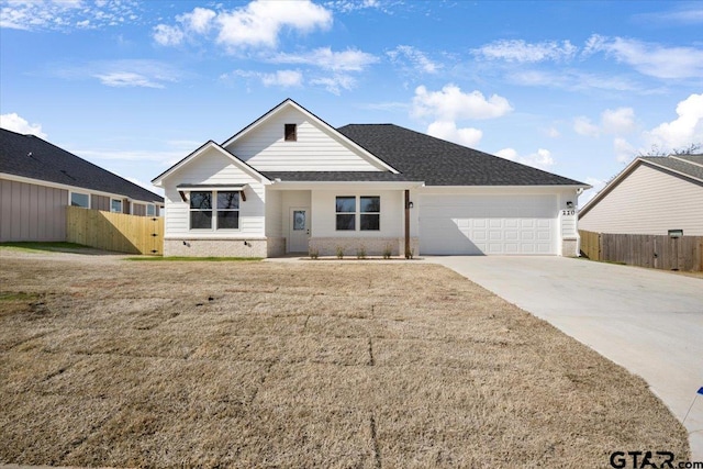 ranch-style house with a garage and a front lawn