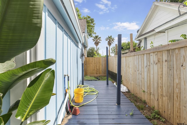 408 Morton Ave, Palacios, TX 77465 - wooden terrace with a fenced backyard