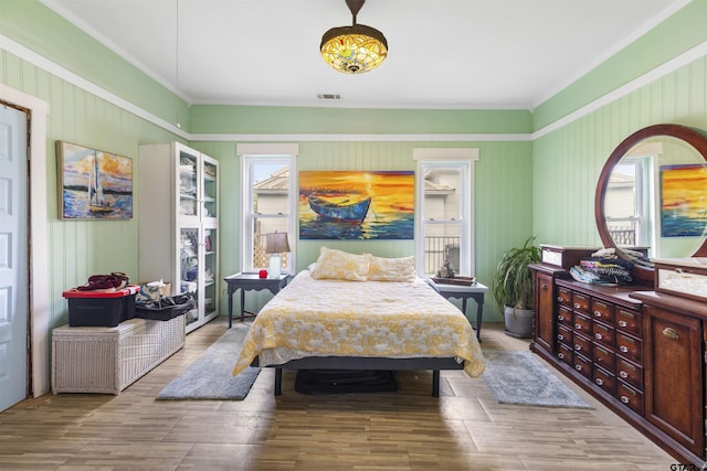 408 Morton Ave, Palacios, TX 77465 - bedroom with crown molding and wood finished floors
