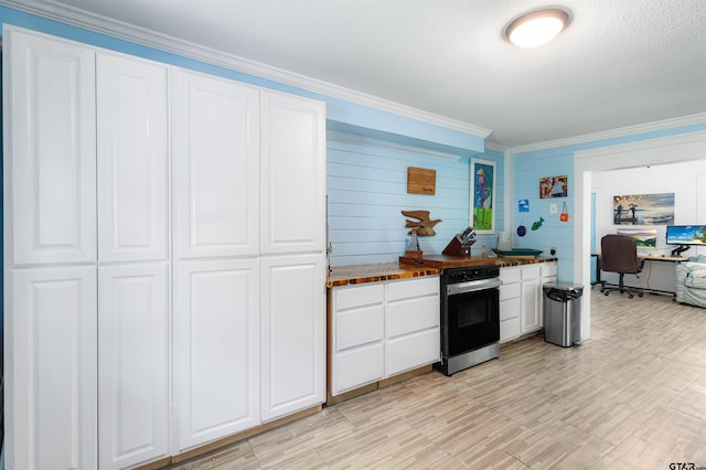 408 Morton Ave, Palacios, TX 77465 - kitchen with an office area, white cabinetry, and crown molding