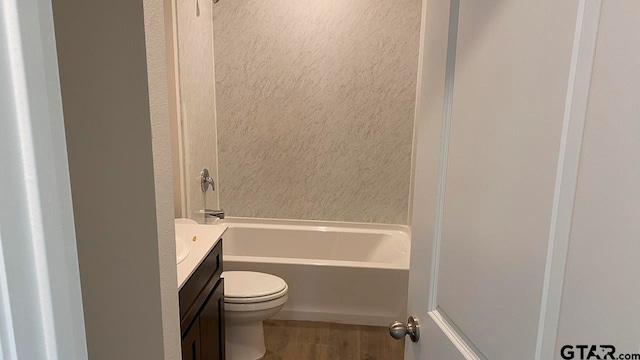 full bathroom featuring toilet, vanity, and shower / bathtub combination