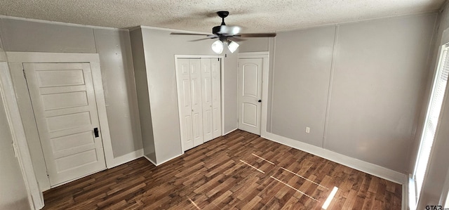 unfurnished bedroom featuring a textured ceiling, ceiling fan, crown molding, and dark hardwood / wood-style floors