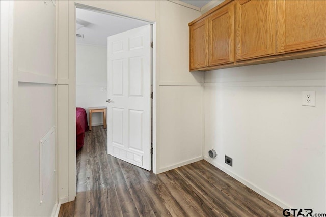 clothes washing area featuring hookup for an electric dryer, cabinets, ornamental molding, and dark wood-type flooring