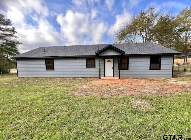 ranch-style house with a front lawn