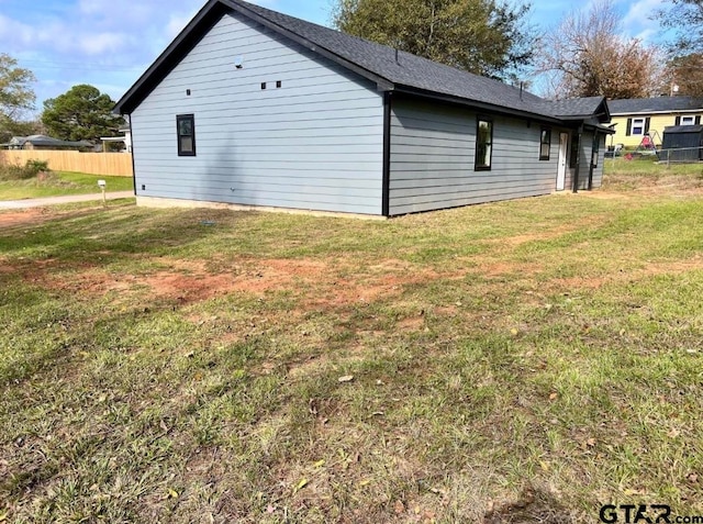 view of home's exterior featuring a yard