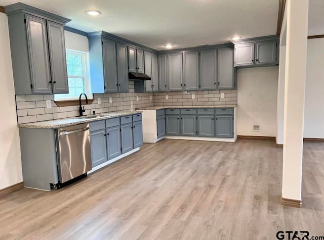 kitchen with light stone countertops, dishwasher, sink, crown molding, and light wood-type flooring