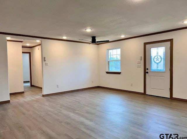 interior space featuring ceiling fan, light hardwood / wood-style flooring, and crown molding