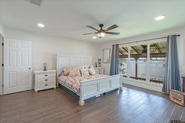 bedroom featuring ceiling fan and dark hardwood / wood-style floors