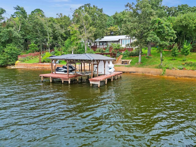 dock area with a water view