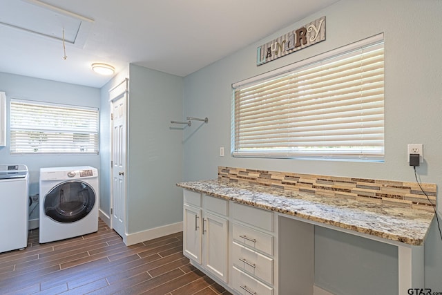 laundry area with dark hardwood / wood-style flooring and washer and clothes dryer