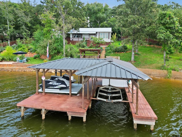 dock area with a water view