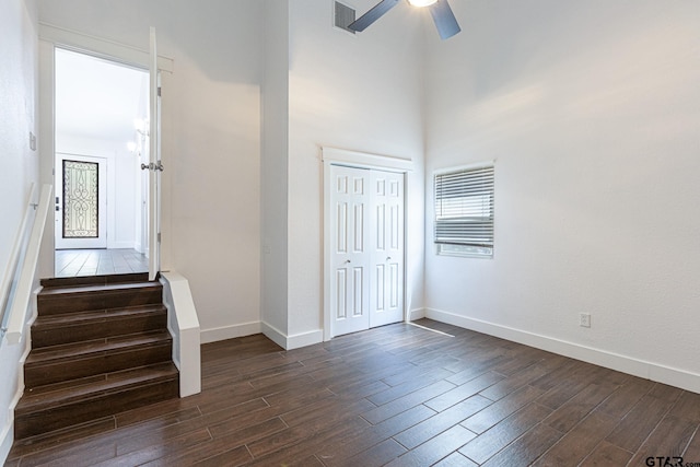 foyer entrance with ceiling fan and dark hardwood / wood-style floors