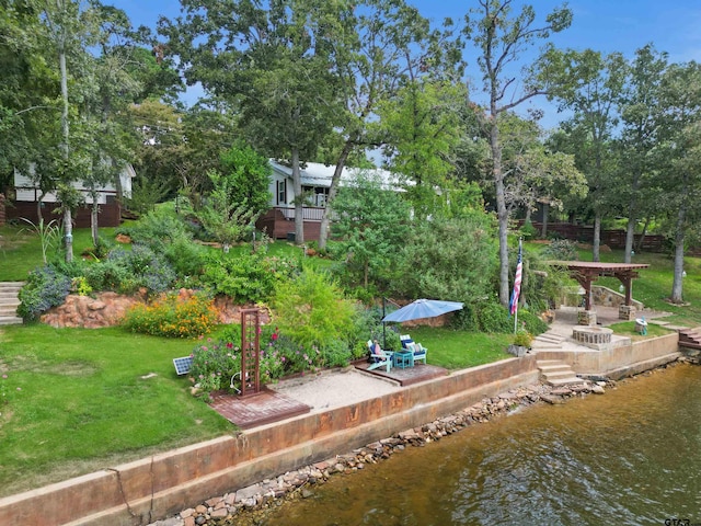 exterior space featuring a water view and a patio area