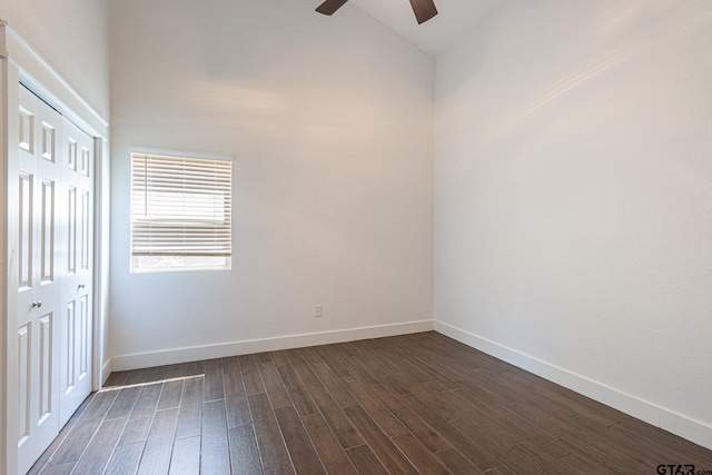 empty room with dark wood-type flooring and ceiling fan