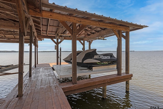 dock area with a water view