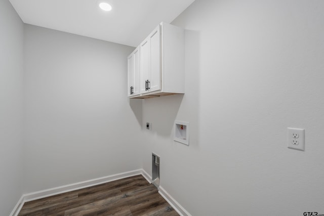 washroom featuring dark wood-type flooring, cabinets, washer hookup, and electric dryer hookup