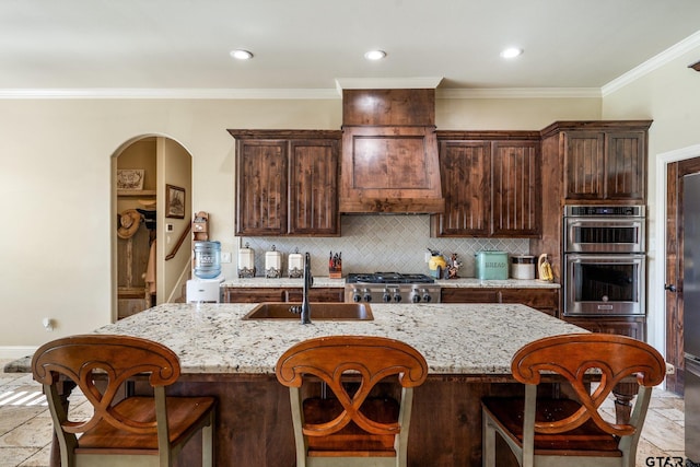 4180 N Smith Rd, Rockwall, TX 75087 - kitchen featuring stainless steel double oven, tasteful backsplash, light stone counters, stone tile floors, and ornamental molding