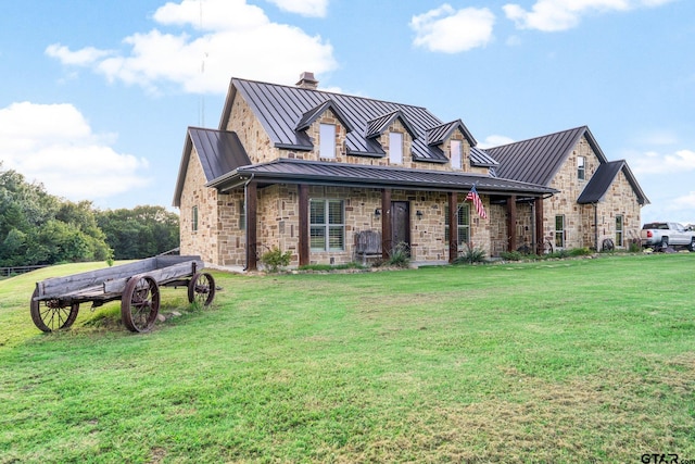 4180 N Smith Rd, Rockwall, TX 75087 - view of front of property featuring a standing seam roof, a front yard, and a metal roof