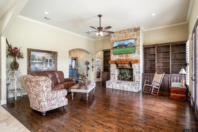 4180 N Smith Rd, Rockwall, TX 75087 - living room featuring arched walkways, a ceiling fan, hardwood / wood-style floors, ornamental molding, and a fireplace