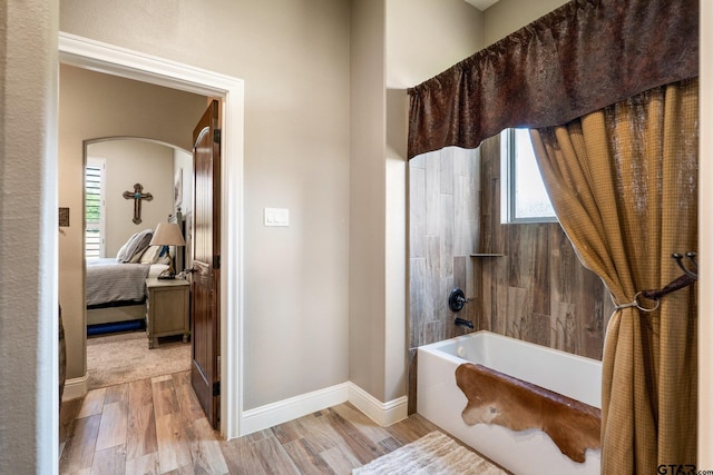 4180 N Smith Rd, Rockwall, TX 75087 - bathroom featuring healthy amount of natural light, wood finished floors, shower / washtub combination, and connected bathroom