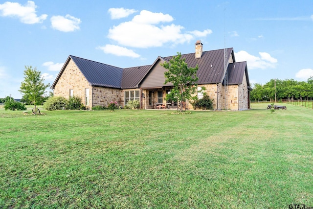 4180 N Smith Rd, Rockwall, TX 75087 - view of front of property with brick siding, a chimney, a metal roof, and a standing seam roof