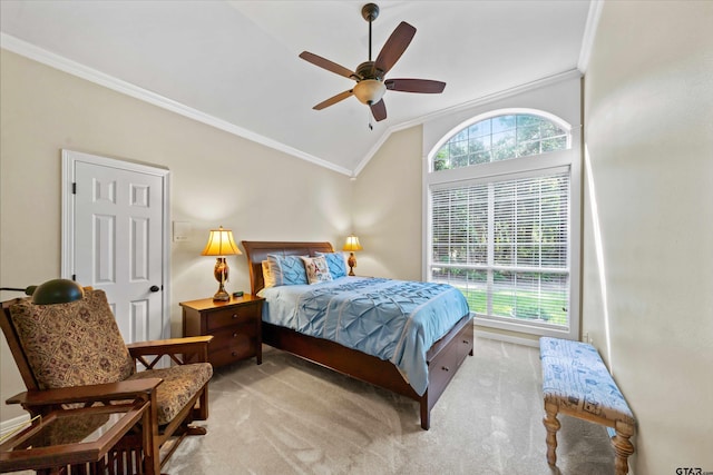 bedroom with ornamental molding, light colored carpet, ceiling fan, and vaulted ceiling