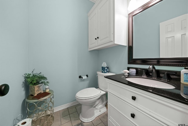 bathroom with tile patterned floors, vanity, and toilet