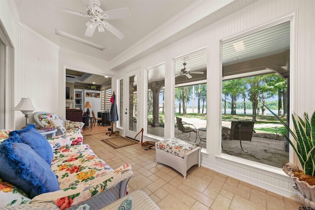 sunroom / solarium with plenty of natural light and ceiling fan