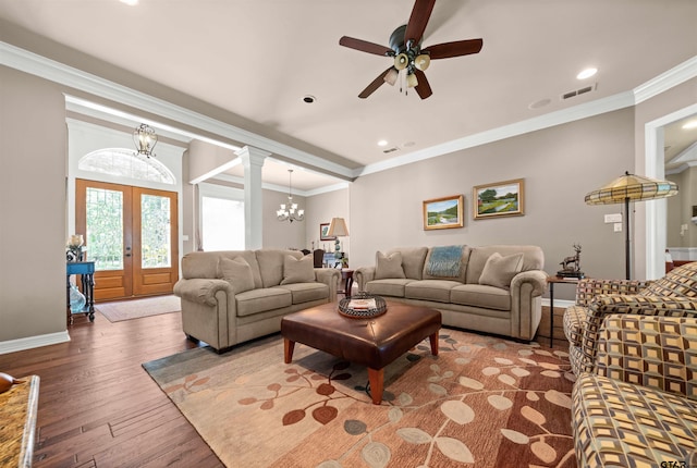 living room with ornamental molding, french doors, ceiling fan with notable chandelier, and wood-type flooring