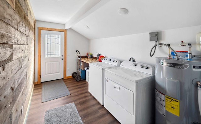 laundry area with washer and dryer, dark wood-type flooring, and water heater