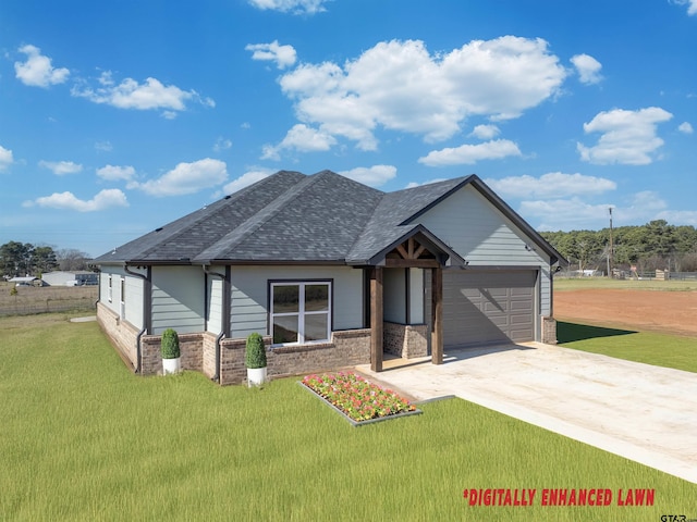 view of front of house featuring a garage and a front yard