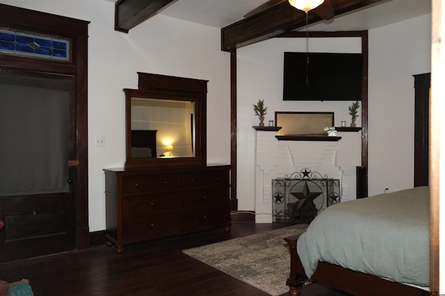 500 W Main St, Mount Vernon, TX 75457 - bedroom with beam ceiling and dark wood-type flooring
