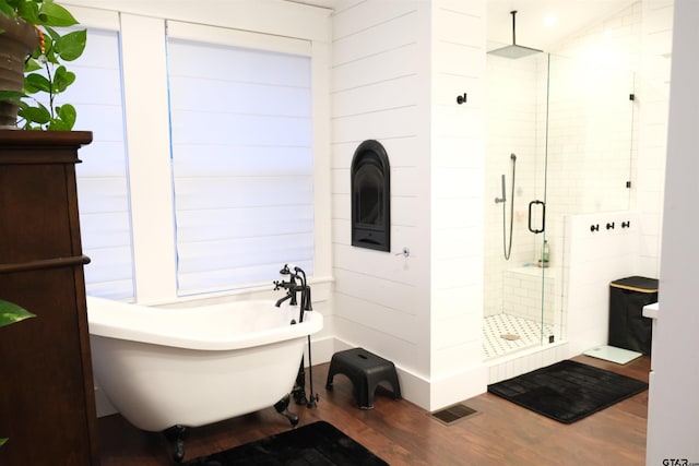 500 W Main St, Mount Vernon, TX 75457 - full bathroom featuring a freestanding bath, wood finished floors, visible vents, and a stall shower