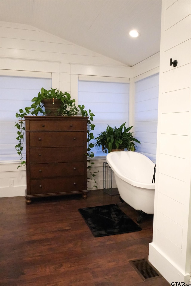 500 W Main St, Mount Vernon, TX 75457 - full bath featuring lofted ceiling, a freestanding tub, wood finished floors, and visible vents