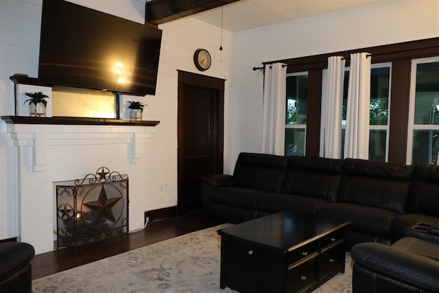 500 W Main St, Mount Vernon, TX 75457 - living area with crown molding, wood finished floors, and a fireplace