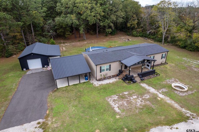 drone / aerial view featuring a view of trees