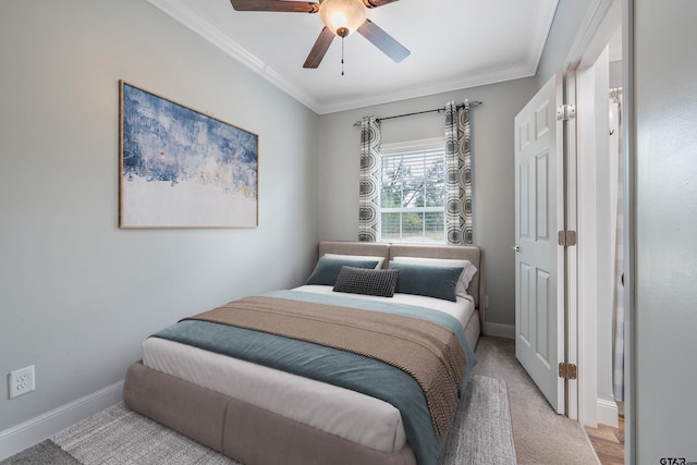 bedroom with baseboards, ceiling fan, and crown molding