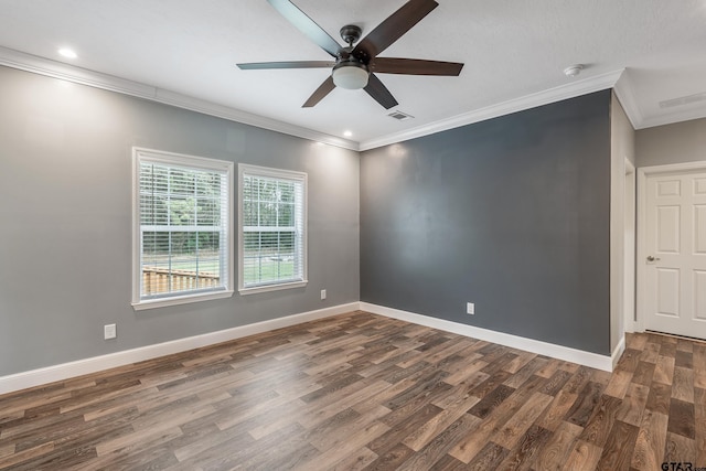unfurnished room with crown molding, visible vents, dark wood-style flooring, and a ceiling fan