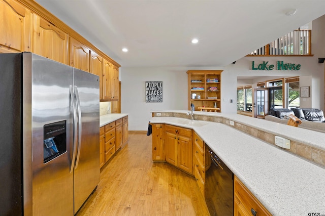 kitchen with stainless steel fridge with ice dispenser, black dishwasher, light hardwood / wood-style floors, and sink