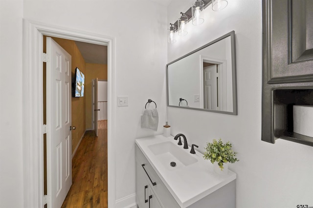 bathroom with hardwood / wood-style floors and vanity