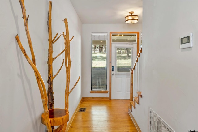 doorway with light hardwood / wood-style floors