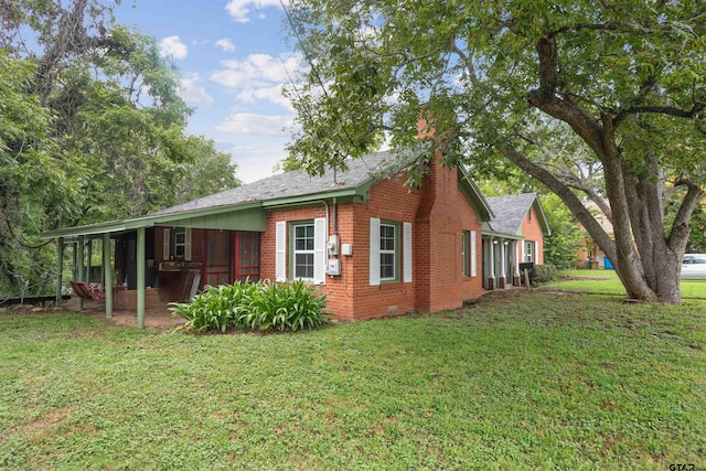 view of home's exterior with a yard